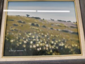 NEN TANAKAのサインがある草原の風景画